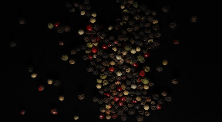 Colorful peppers on black background