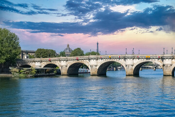 Fototapeta premium Paris, the Pont-Neuf on the Seine, typical view, with the dome of the Institut de France and the Eiffel Tower in background 