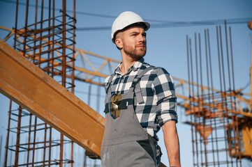 Confident worker. Man is on the construction site at daytime