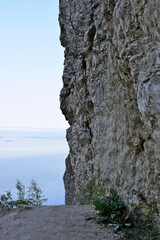 rocky wall on the top of the mountain with hiking trail