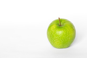 Green apple on a white background isolated, copy space.
