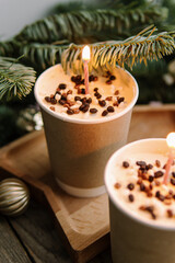 Two small chocolate cakes in paper cups. Natural. Cake to go. Treat for New Year or Christmas. Cake with candles. Birthday cake