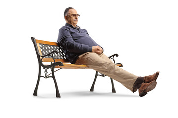 Pensive mature man sitting on a bench