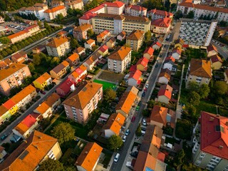  Aerial view of a small city from Romania. Apartment buildings, streets and vegetation is depicted in the picture. Name of city: Resita.
