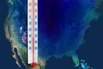 Thermometer with record low temperature map diagram, against the backdrop of the continent of North...