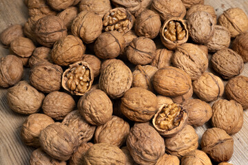 close up of walnuts, autumn fruit on the wooden table, gluten free