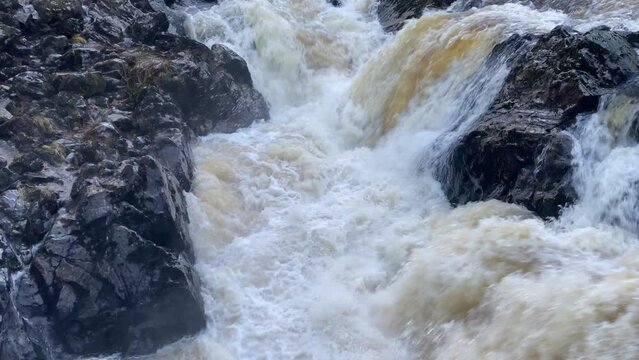 River Dee fast flowing due to high water level during the winter at the Bridge of Feugh