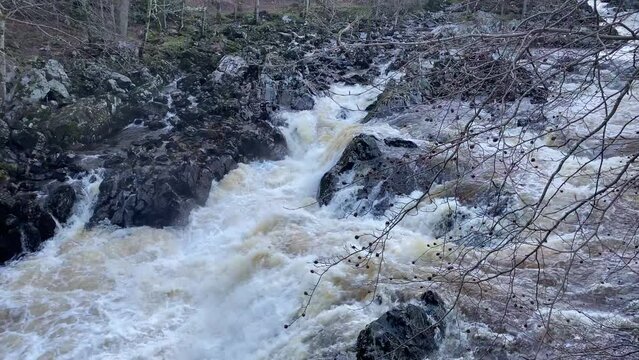 River Dee fast flowing due to high water level during the winter at the Bridge of Feugh
