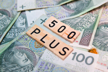 inscription 500 plus next to polish money. 500 plus is a state program in the field of social policy