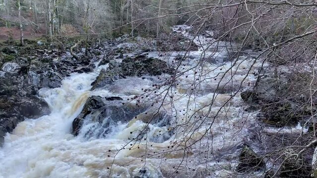 River Dee fast flowing due to high water level during the winter at the Bridge of Feugh