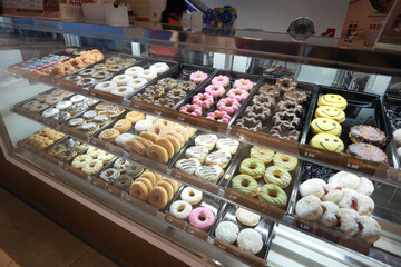chocolate donuts display for sale at local store 