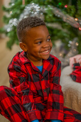 portrait of a child in black and red pajamas