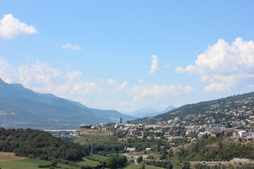 Alpine landscape in the Hautes-Alpes with the town Embrun.
