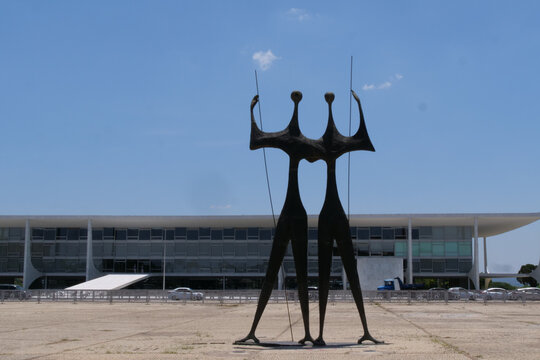 'Os Candangos' or 'Dois Guerreiros' statue which translates to "Two Warriors" located in the square of the three powers or Pra&ccedil;a dos Tr&ecirc;s Poderes in the city of Brasilia.