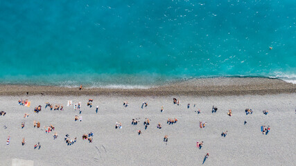 Top view on sea and people on beach. Drone shot, aerial view in Nice, France