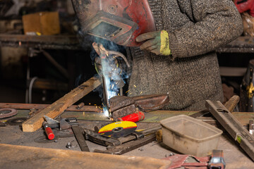 Welding process in the industrial workshop by worker