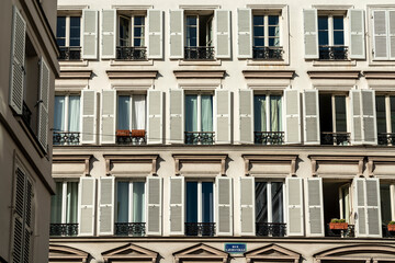Fototapeta premium Facade of a traditional old house in Paris with windows, Paris, France