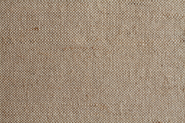 Background - beige rough tarpaulin cloth. Horizontal photo. Closeup. Macro