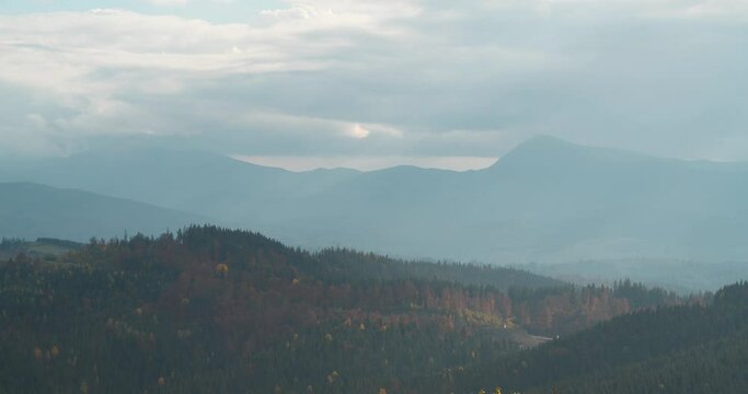 View of the highest mountains in Ukraine - Hoverla, left, and Petros, right, Chornohora mountain range. View from Bukovel - village and largest ski resort in Carpathian Mountains