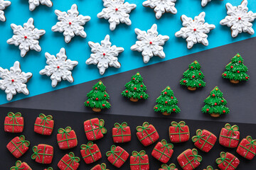 Christmas background with festive gingerbread covered with icing, flat lay.