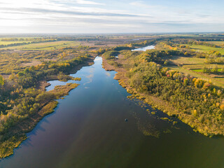 Aerial view of Kremmener See, in the countryside with forest and fields surrounding, Kremmen, Brandenburg