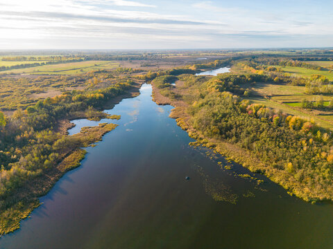 Aerial view of Kremmener See, in the countryside with forest and fields surrounding, Kremmen, Brandenburg