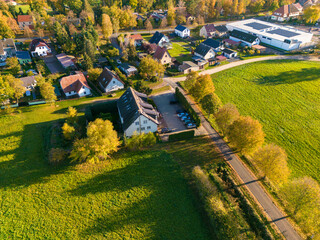 Aerial view of houses in the countryside in Kremmen, Brandenburg with fields and forest surrounding...