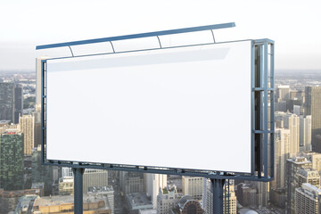 Fototapeta premium Blank white horizontal billboard on cityscape background at daytime, perspective view. Mockup, advertising concept