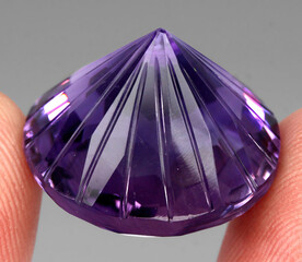 Natural stone purple amethyst on a gray background