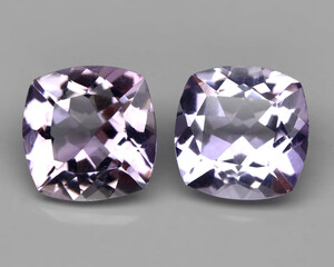 Natural stone purple amethyst on a gray background