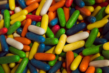 Colorful sweets in the market. Food with colored sugars.
