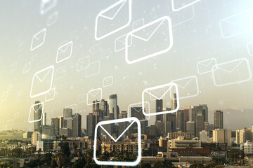 Double exposure of abstract virtual postal envelopes hologram on Los Angeles city skyscrapers background. Electronic mail and spam concept