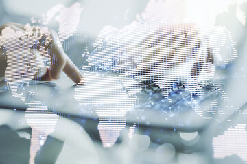 Multi exposure of abstract creative digital world map and hands typing on computer keyboard on background, tourism and traveling concept