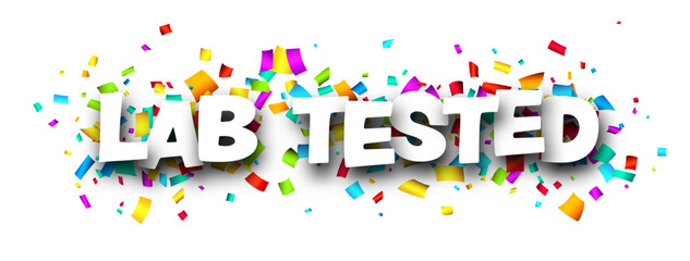 Lab tested sign with colorful cut out ribbon confetti background.