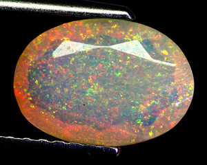 Natural beautiful gemstone opal on gray background