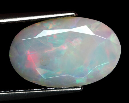 Natural beautiful gemstone opal on gray background