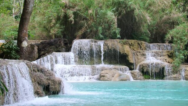 Beautiful Clear Waterfall Cascade In Tropical Rainforest, Kuang Si Falls In Luang Prabang, Laos
