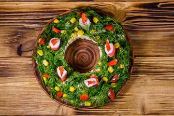 Festive salad in shape of the Christmas wreath. Christmas and new year celebration. Top view