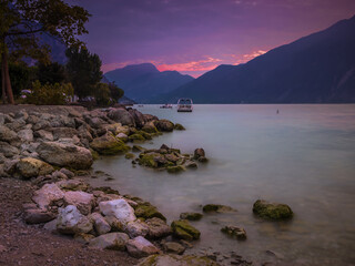 Pink colors of the sky during sunrise over Lake Garda