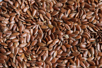 Flaxseed or linseed background and texture. Concept of ingredients, seeds and health foods.