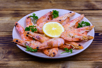 Shrimps with lemon and parsley on a plate