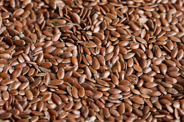 Flaxseed or linseed background and texture. Concept of ingredients, seeds and health foods.