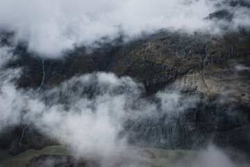 A view of the Austrian Alps on the Grossglockner. Foggy day in the mountains. Shot of beautiful steep rocks.