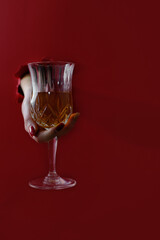 Trend paper whole woman hand with a glass of liquor