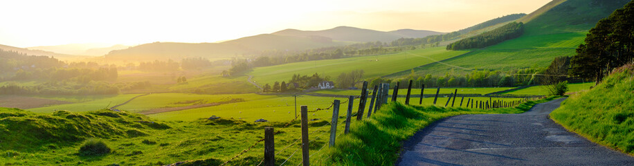 Panorama Of A Rural Road In Scotland At Sunset - obrazy, fototapety, plakaty