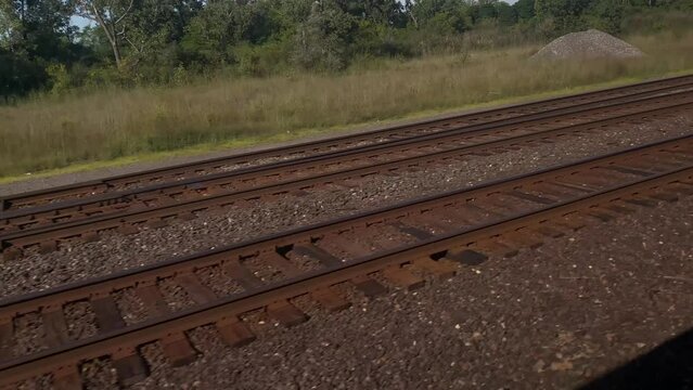 railroad tracks in two directions. A close-up view of a railway track. Background concept in logistics and industrial transportation choice travel cargo