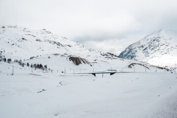 Fototapeta na wymiar Beautiful winter Alps of Switzerland. Snowy winter mountains landscape