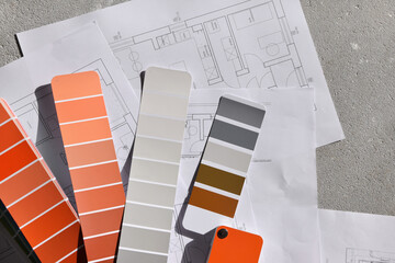 Próbnik kolorów oraz plany architektoniczne rozłożone na surowej podłodze w nowym domu - obrazy, fototapety, plakaty