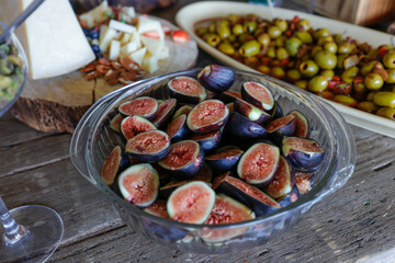 slices of figs, cheese and olives, natural fats, omega and protein