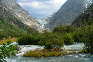 Fototapeta na wymiar Glacier melting stream, Norway, National park Jostedalsbreen mountain landscape view.